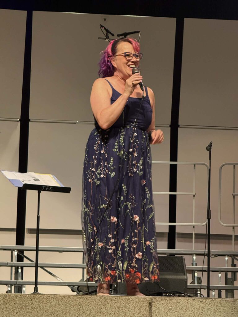 Marie addressing the audience 